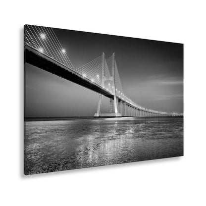 Leinwandbild Goldenes Leuchten über Brücke bei ruhigem Abendmeer XXL – Landschaft - deyoli