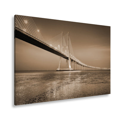 Leinwandbild Goldenes Leuchten über Brücke bei ruhigem Abendmeer XXL – Landschaft - deyoli
