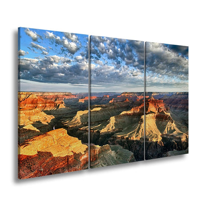 Leinwandbild Grand Canyon XXL – Sonnenlicht malt goldene Schatten in die Weiten - deyoli