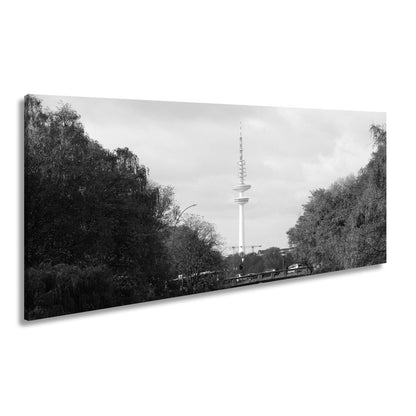 Leinwandbild Hamburg XXL – Goldene Alsterbrücke unter herbstlichen Bäumen mit Funkturm - deyoli