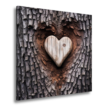 Leinwandbild Handwerk der Natur – geschnitzte Liebe im Baumherz. - deyoli
