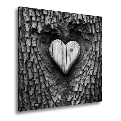 Leinwandbild Handwerk der Natur – geschnitzte Liebe im Baumherz. - deyoli