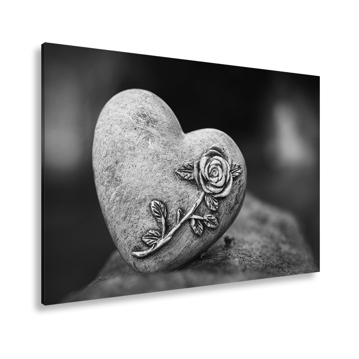 Leinwandbild Herz aus Stein – verziert mit einer Rose der Erinnerung. - deyoli