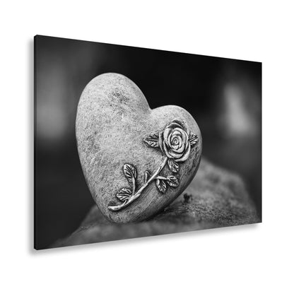 Leinwandbild Herz aus Stein – verziert mit einer Rose der Erinnerung. - deyoli