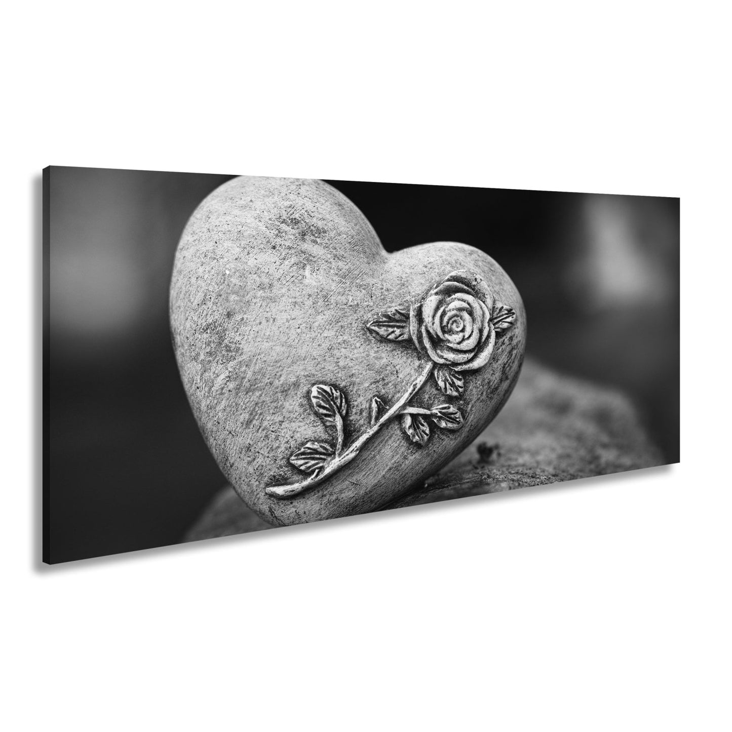 Leinwandbild Herz aus Stein – verziert mit einer Rose der Erinnerung. - deyoli