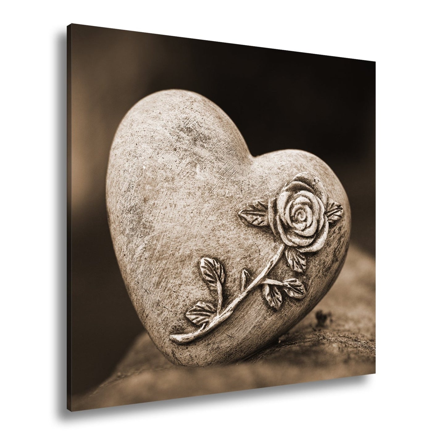 Leinwandbild Herz aus Stein – verziert mit einer Rose der Erinnerung. - deyoli