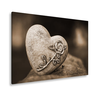 Leinwandbild Herz aus Stein – verziert mit einer Rose der Erinnerung. - deyoli