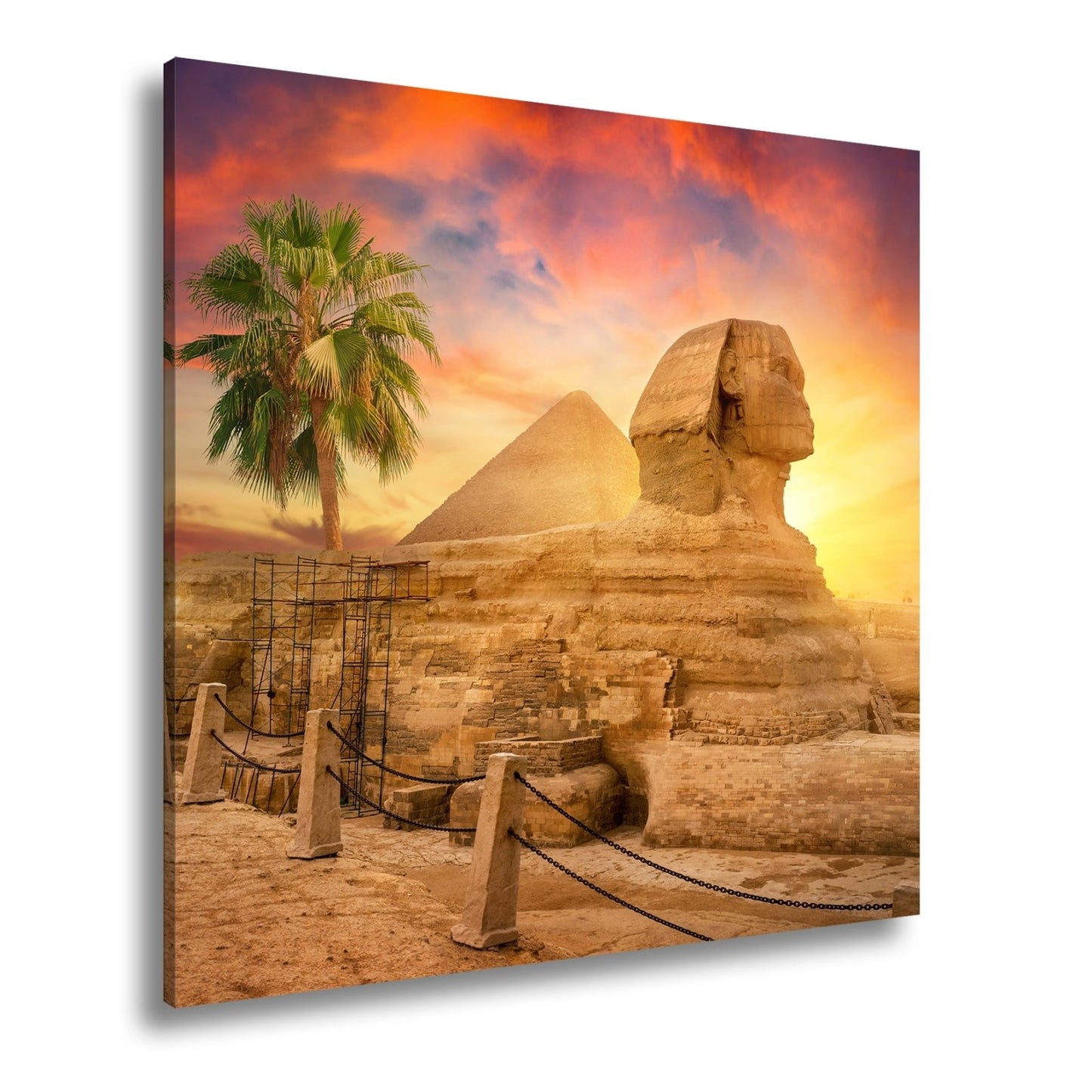 Leinwandbild Im Glanz der Sonne – die Sphinx ruht vor ägyptischer Pracht. - deyoli