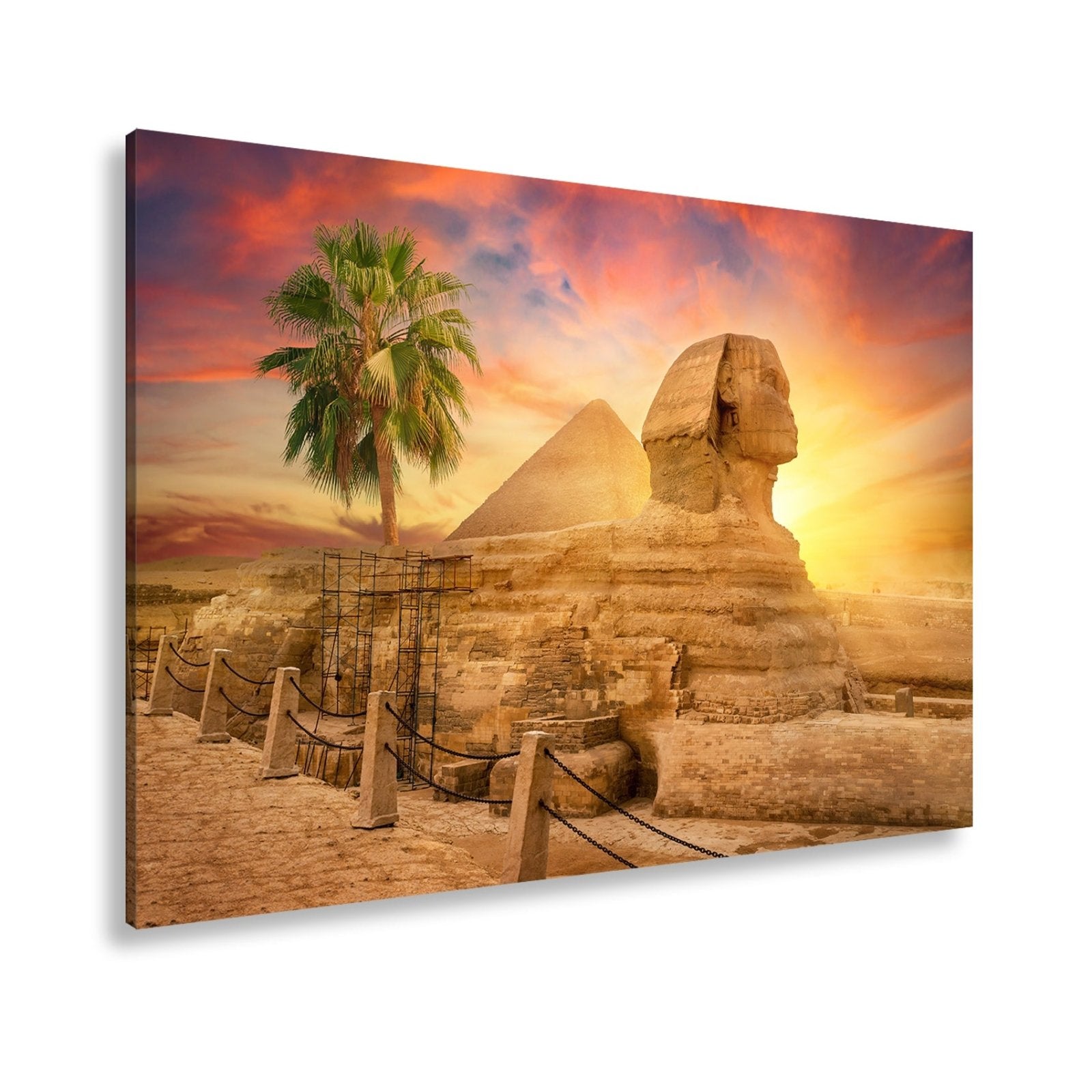 Leinwandbild Im Glanz der Sonne – die Sphinx ruht vor ägyptischer Pracht. - deyoli