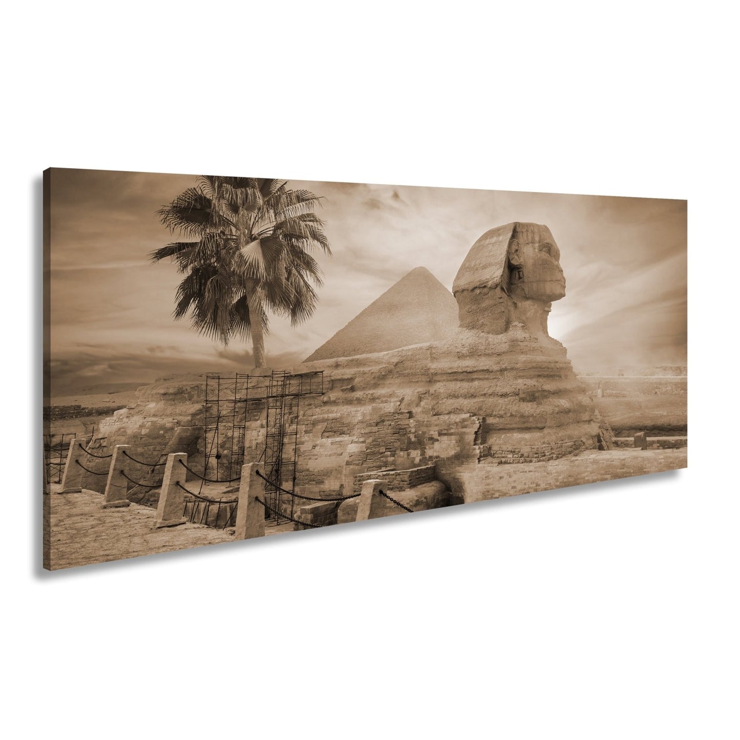 Leinwandbild Im Glanz der Sonne – die Sphinx ruht vor ägyptischer Pracht. - deyoli