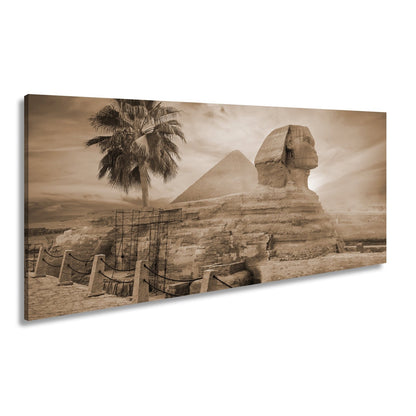 Leinwandbild Im Glanz der Sonne – die Sphinx ruht vor ägyptischer Pracht. - deyoli