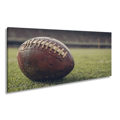 Leinwandbild Leder, Rasen, Spannung – Football in Nahaufnahme. - deyoli