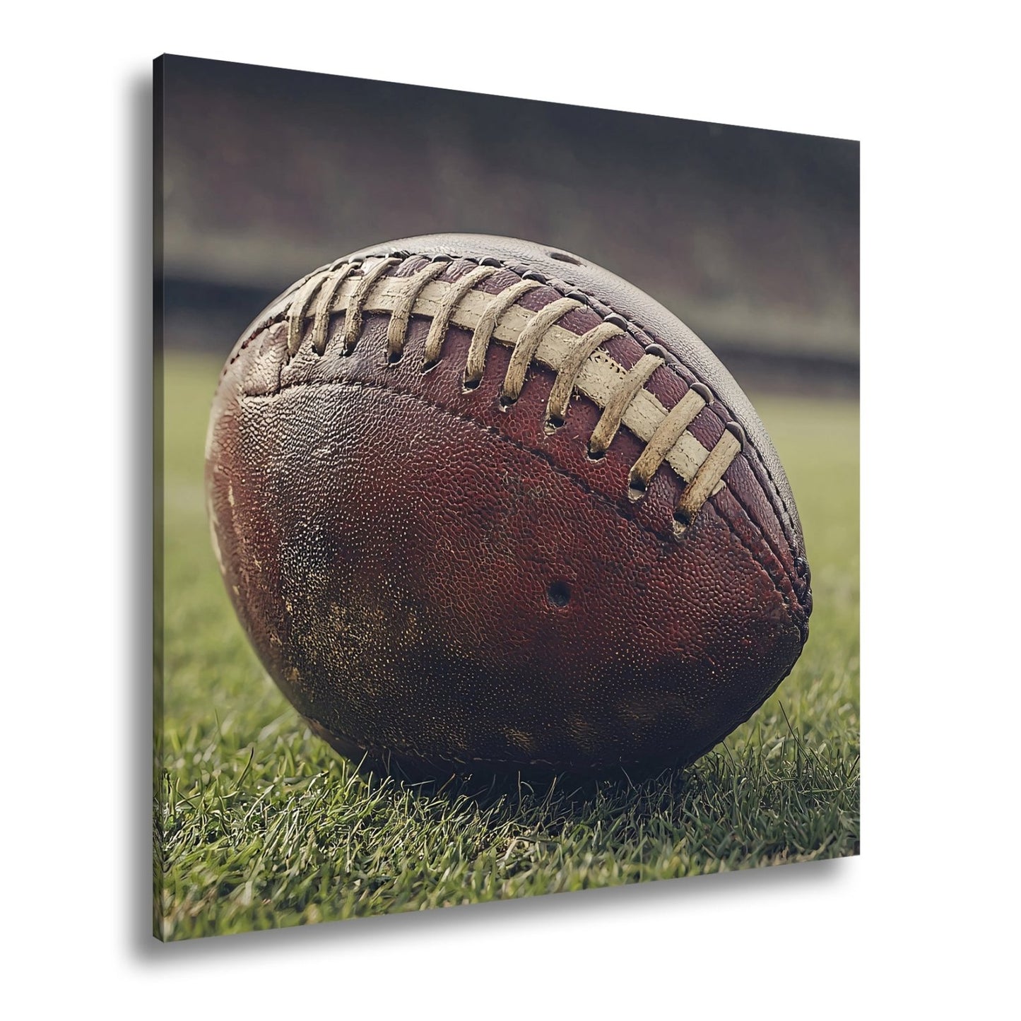 Leinwandbild Leder, Rasen, Spannung – Football in Nahaufnahme. - deyoli