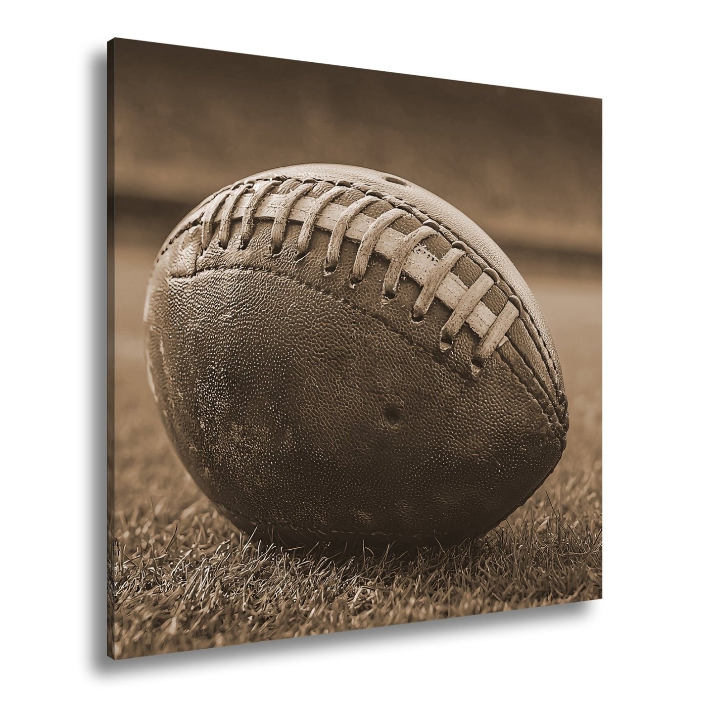 Leinwandbild Leder, Rasen, Spannung – Football in Nahaufnahme. - deyoli