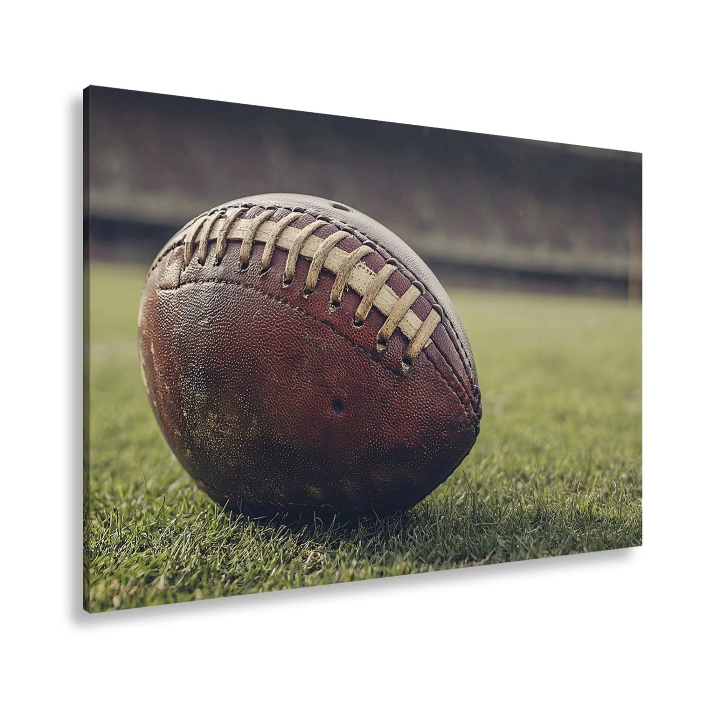 Leinwandbild Leder, Rasen, Spannung – Football in Nahaufnahme. - deyoli
