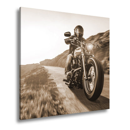 Leinwandbild Motorradfahrer im Sonnenlicht – Kurvige Bergstraße XXL - deyoli
