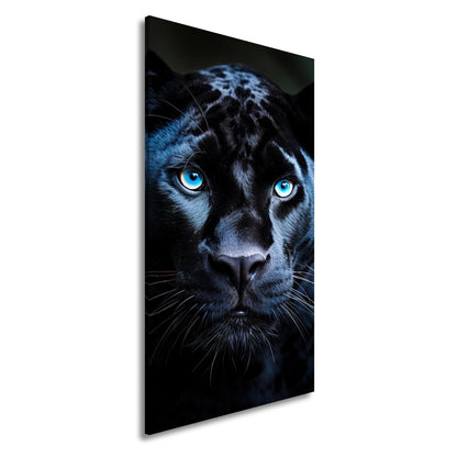 Leinwandbild Pantherblick – eisblaue Augen durchdringen die Dunkelheit. - deyoli