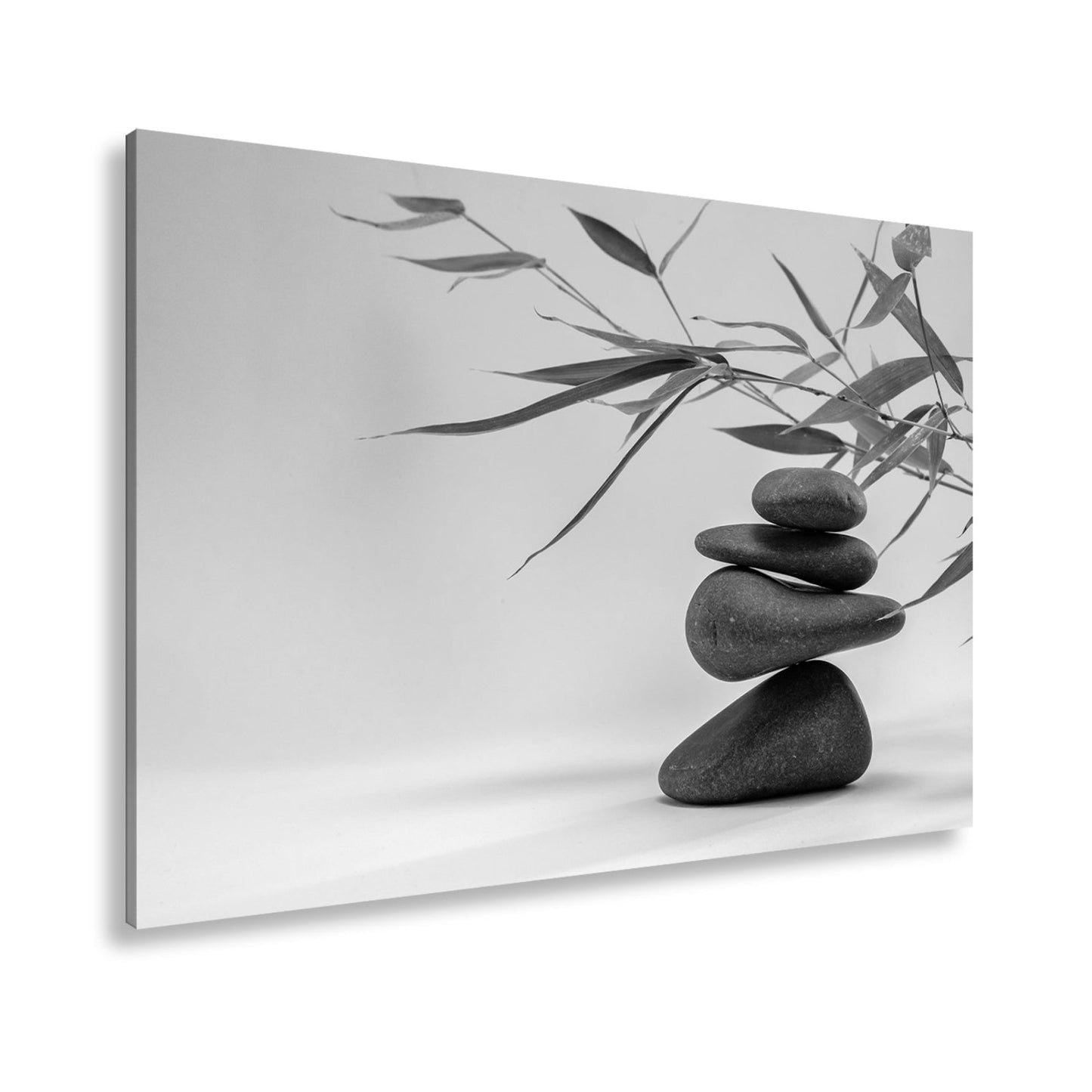 Leinwandbild Sanftes Gleichgewicht – dunkle Steine und zarte Bambusblätter. - deyoli