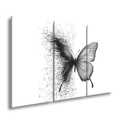 Leinwandbild Schmetterling löst sich in kunstvolle Partikel auf - deyoli