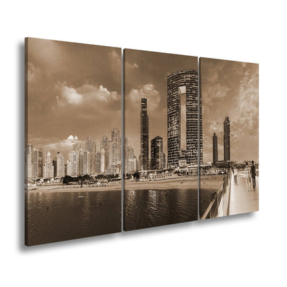 Leinwandbild Skyline XXL – Moderne Hochhäuser am Meer bei Sonnenuntergang - deyoli