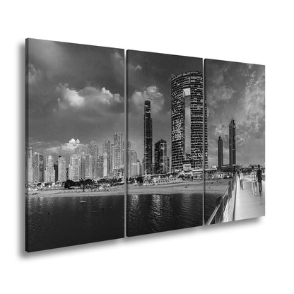 Leinwandbild Skyline XXL – Moderne Hochhäuser am Meer bei Sonnenuntergang - deyoli