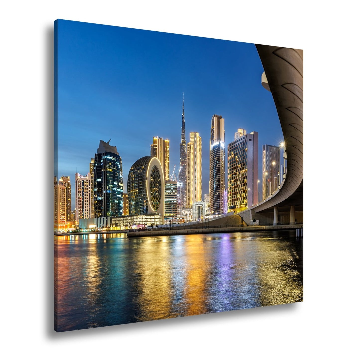 Leinwandbild Skyline XXL – Nächtlich spiegelt sich strahlend im ruhigen Wasser - deyoli