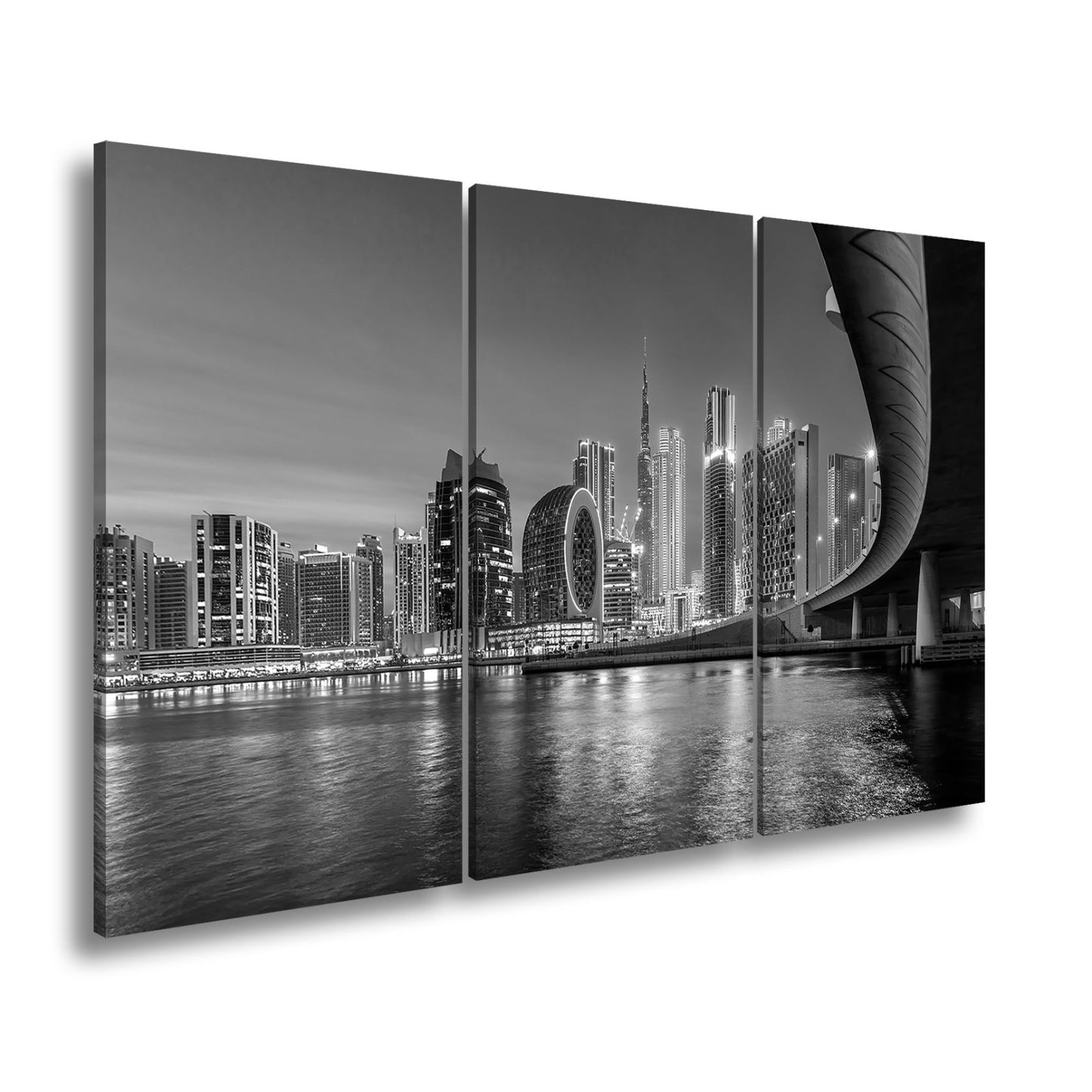 Leinwandbild Skyline XXL – Nächtlich spiegelt sich strahlend im ruhigen Wasser - deyoli