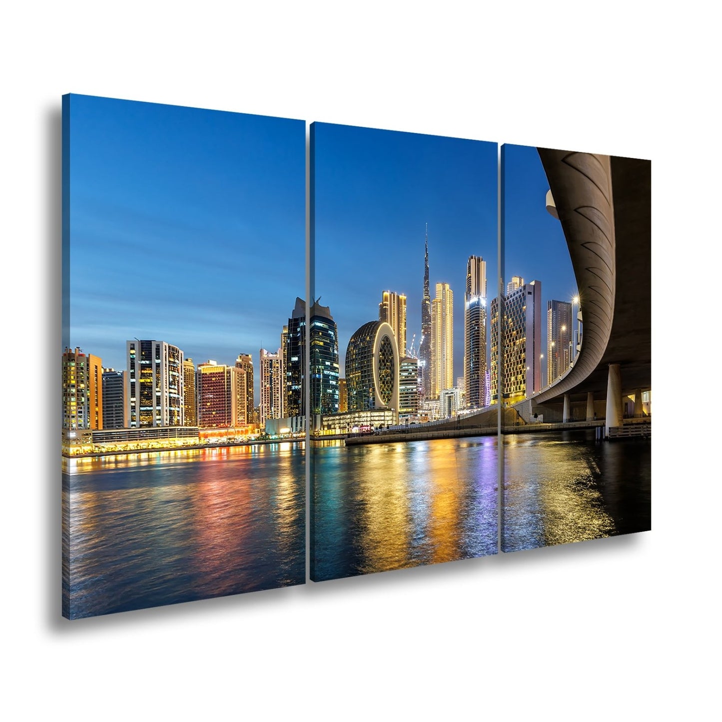 Leinwandbild Skyline XXL – Nächtlich spiegelt sich strahlend im ruhigen Wasser - deyoli