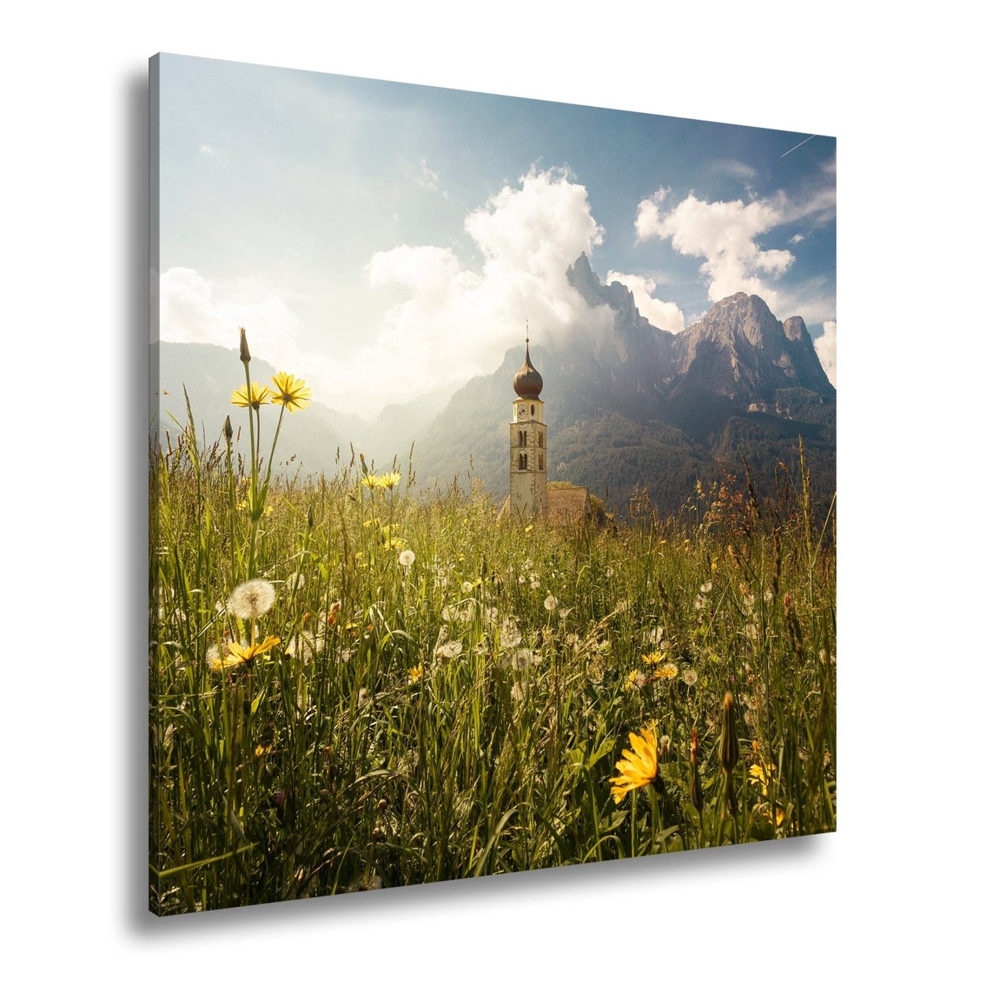 Leinwandbild Sommerwiese und Kirchturm vor majestätischer Bergkulisse - deyoli