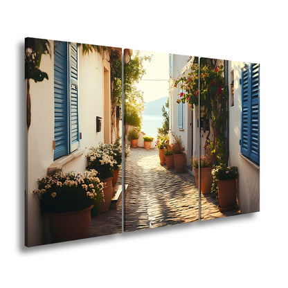 Leinwandbild Sonnengeküsste Gasse – Mediterraner Charme XXL - deyoli