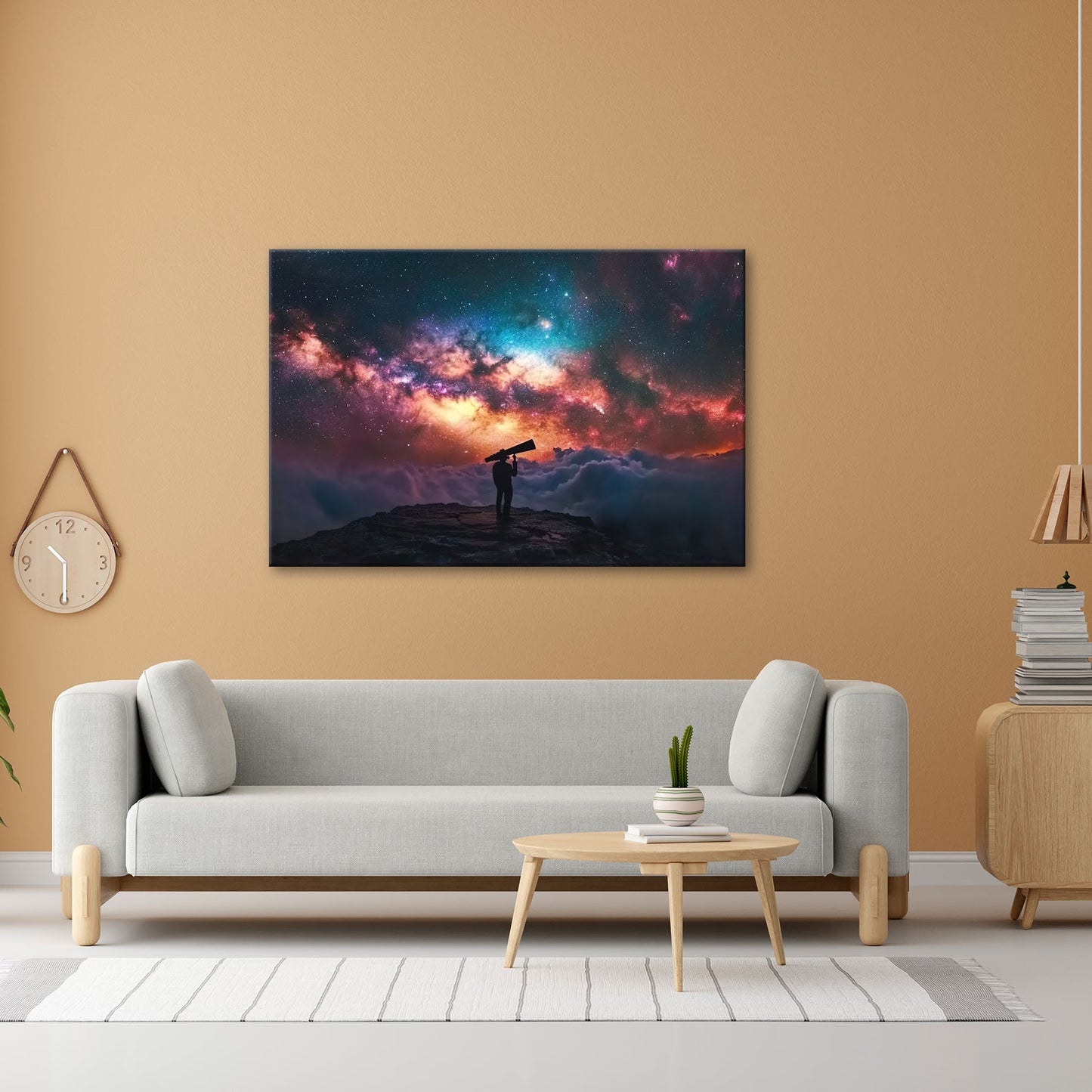 Leinwandbild Sternenbeobachter vor leuchtender Galaxie über den Wolken - deyoli