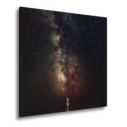 Leinwandbild Sternentor aus Licht über stiller Küste - deyoli