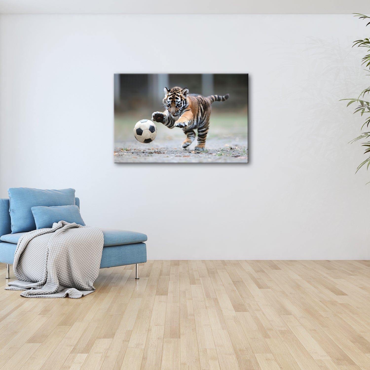 Leinwandbild Tigerbaby im Spielrausch – voller Energie am Ball. - deyoli