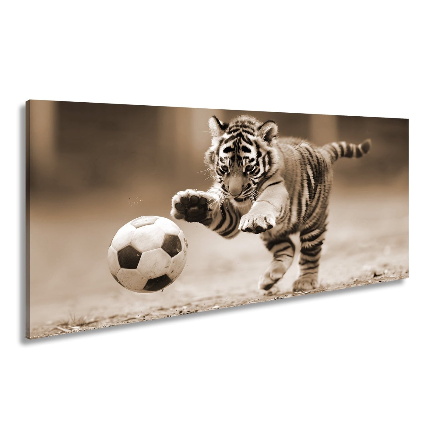 Leinwandbild Tigerbaby im Spielrausch – voller Energie am Ball. - deyoli