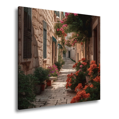 Leinwandbild Verwunschene Gasse voller Blütenpracht und mediterranem Charme - deyoli