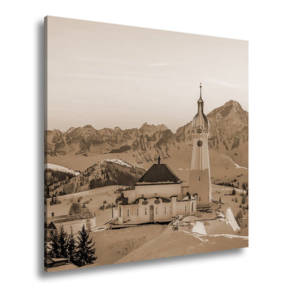 Leinwandbild Winterkirche im Alpenglühen – Stille trifft Erhabenheit. - deyoli