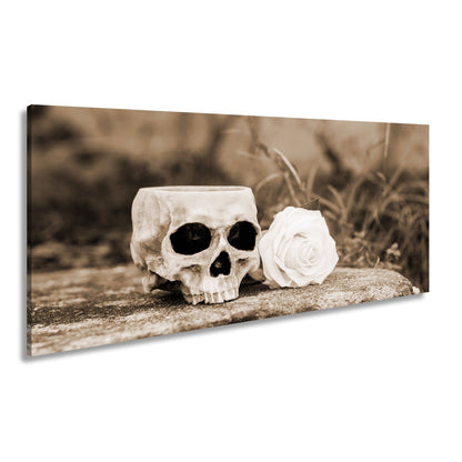 Leinwandbild XXL Totenkopf – Ein leerer Blick mit weißer Rose - deyoli