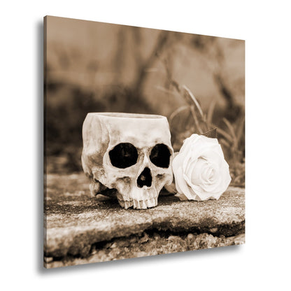 Leinwandbild XXL Totenkopf – Ein leerer Blick mit weißer Rose - deyoli