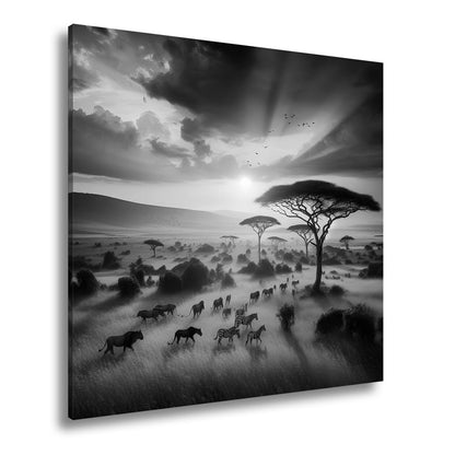 Leinwandbild Zebras ziehen durch flammende Savanne im Abendlicht. - deyoli