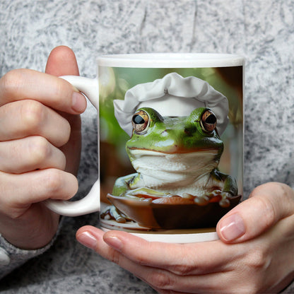 Motivtasse Frosch mit Kochmütze – stiller Gourmet am Werk. - deyoli