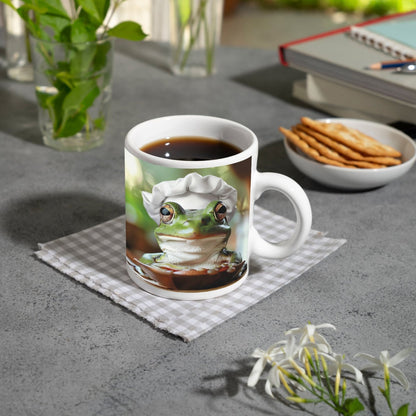Motivtasse Frosch mit Kochmütze – stiller Gourmet am Werk. - deyoli