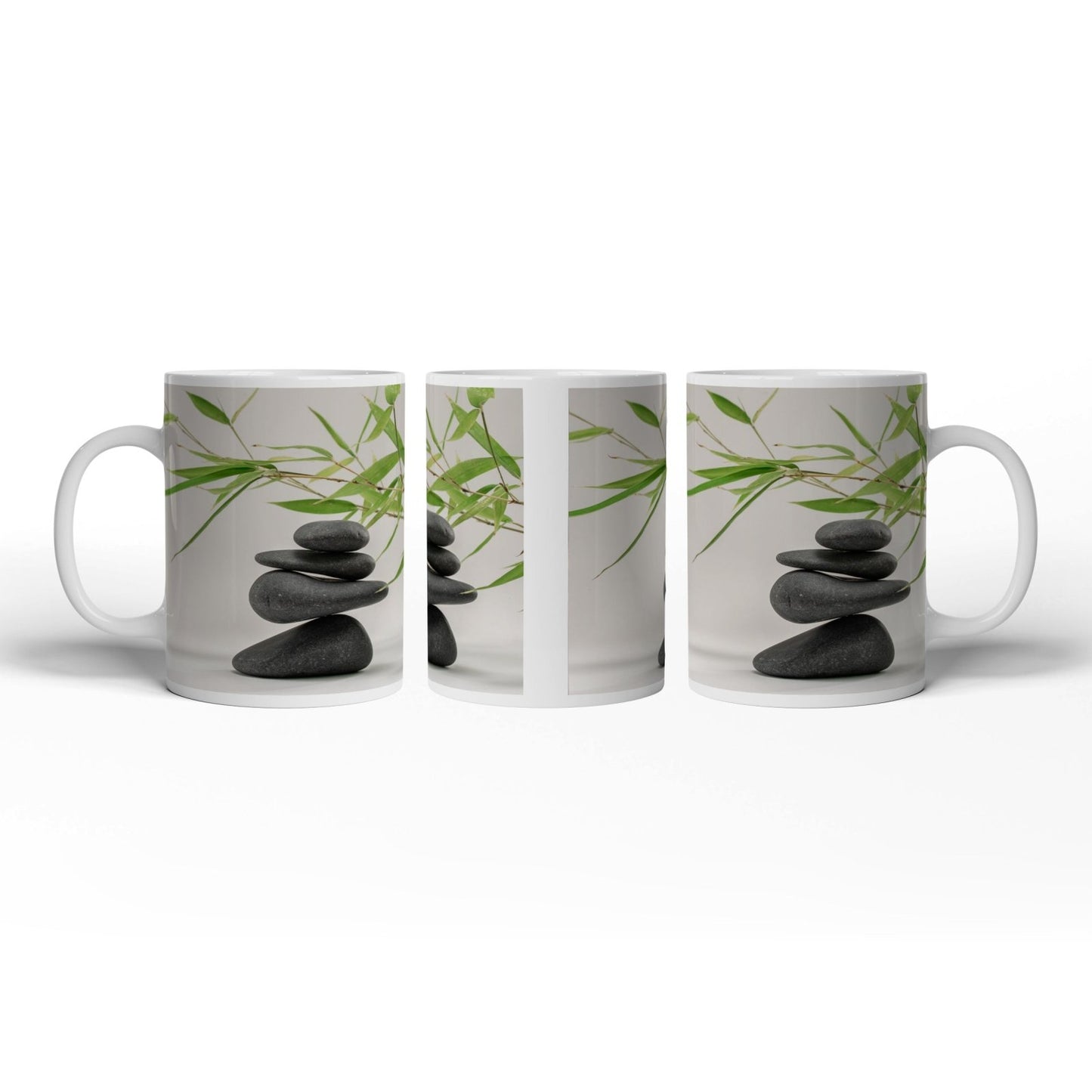 Motivtasse Sanftes Gleichgewicht – dunkle Steine und zarte Bambusblätter. - deyoli