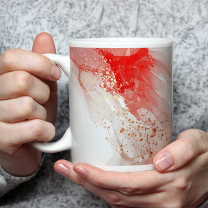 Motivtasse Sanftes Rot verläuft in goldenen Tropfen über Licht. - deyoli